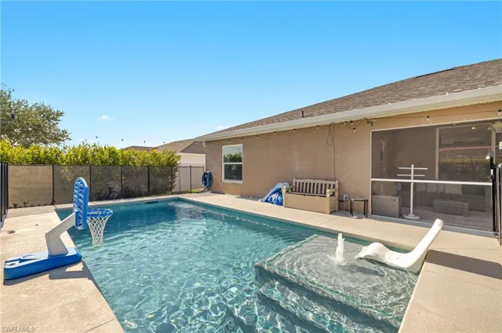 View of swimming pool with fence