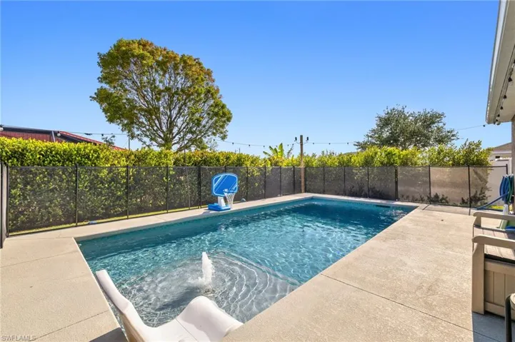 View of swimming pool with fence