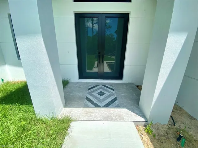 Entrance to property featuring french doors