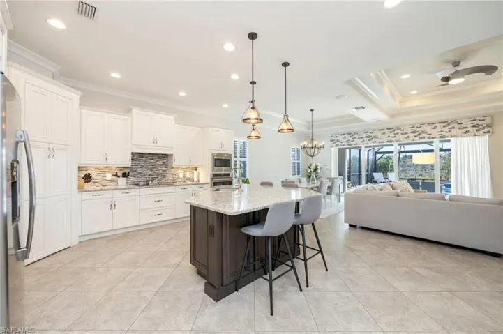 Walk-in pantry, abundant storage, stainless appliances, crown molding, under cabinet lighting and built-in water filter