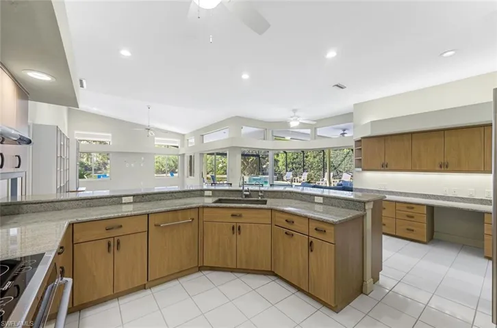 Kitchen with sink, plenty of natural light, and ceiling fan