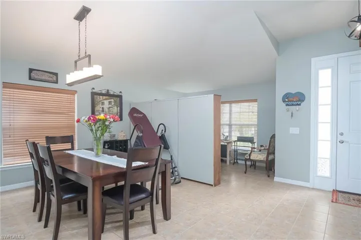 Dining space featuring light tile patterned flooring