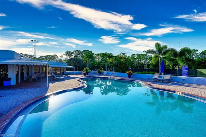 Community pool featuring a patio