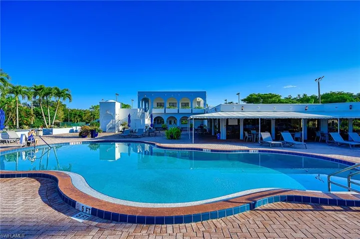 Community pool with a patio area