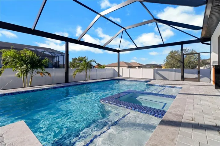 Heated salt water pool and spa with 2 sun shelves and color changing LED lights