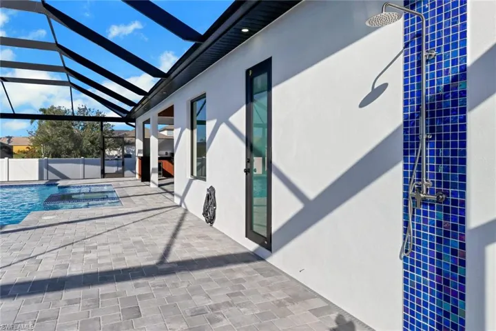 Lanai with shower and dedicated 1/2 bath for pool area.