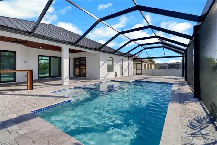 Heated salt water pool and spa with 2 sun shelves and color changing LED lights