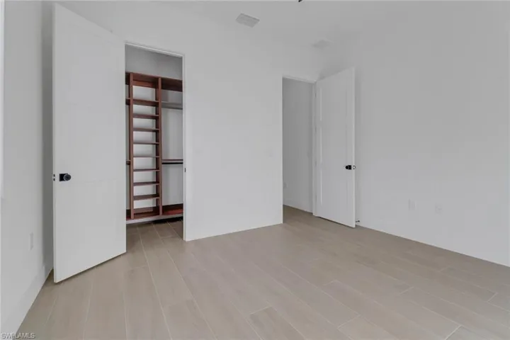 Guest room w/ custom closet cabinets