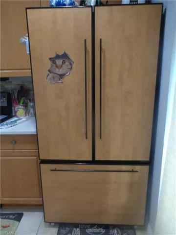 Detailed view of paneled built in fridge