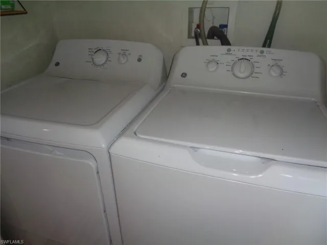 Laundry room featuring independent washer and dryer