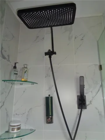 Bathroom view of a marble finish shower