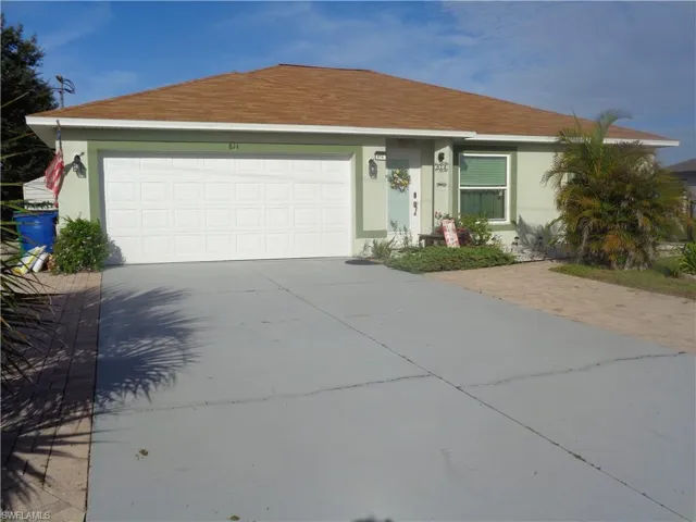 Ranch-style house featuring stucco siding, driveway, roof with shingles, and a garage