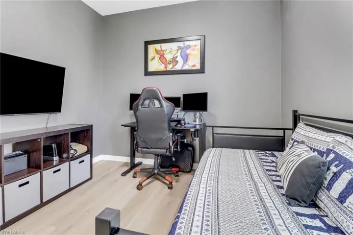 Bedroom with baseboards and light wood-style floors