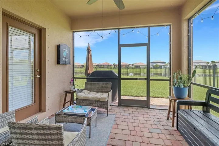 Sunroom featuring a ceiling fan
