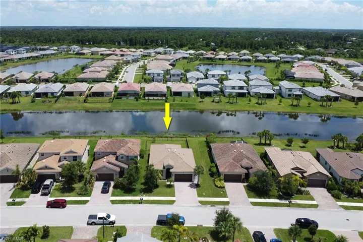 Drone / aerial view featuring a residential view and a water view