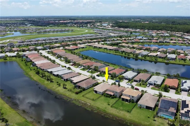 Aerial view featuring a water view and a residential view