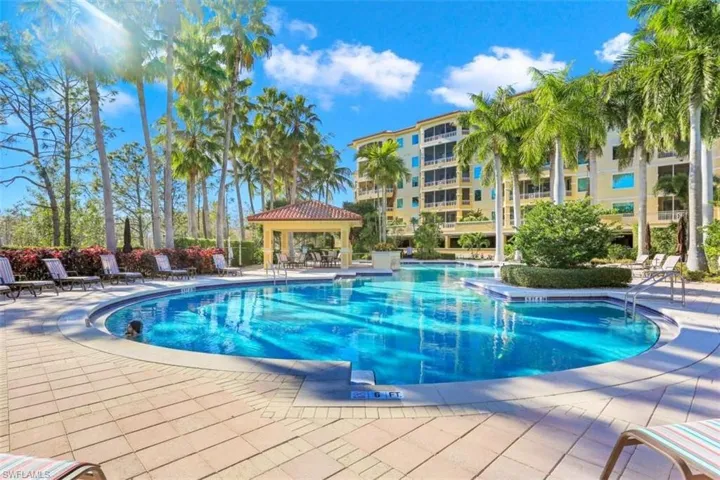 Community pool featuring a patio and a gazebo