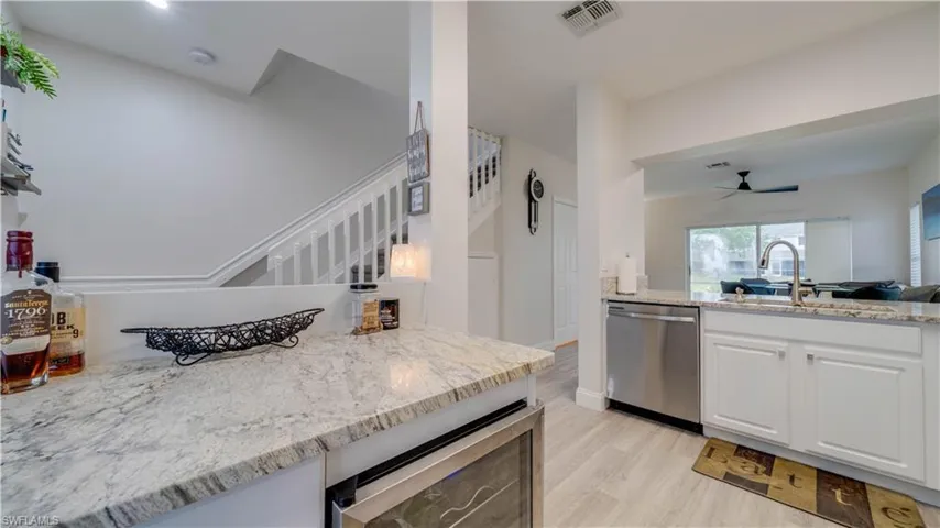 KItchen has extra cabinet with wine fridge!