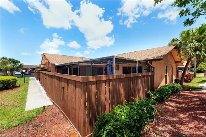 Back of property featuring wood privacy fence