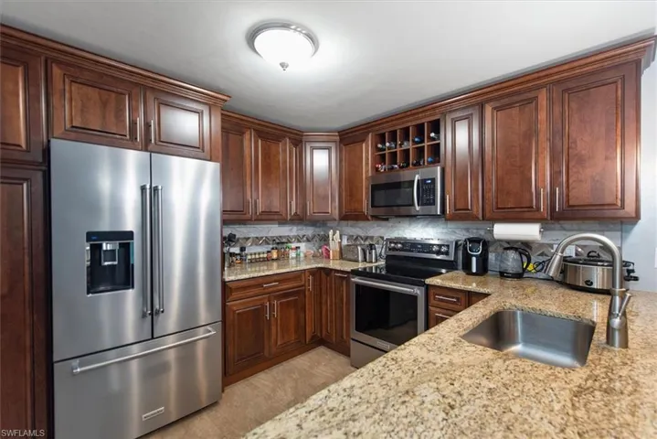 Kitchen with stainless steel appliances, granite counter tops and soft closed cabinets