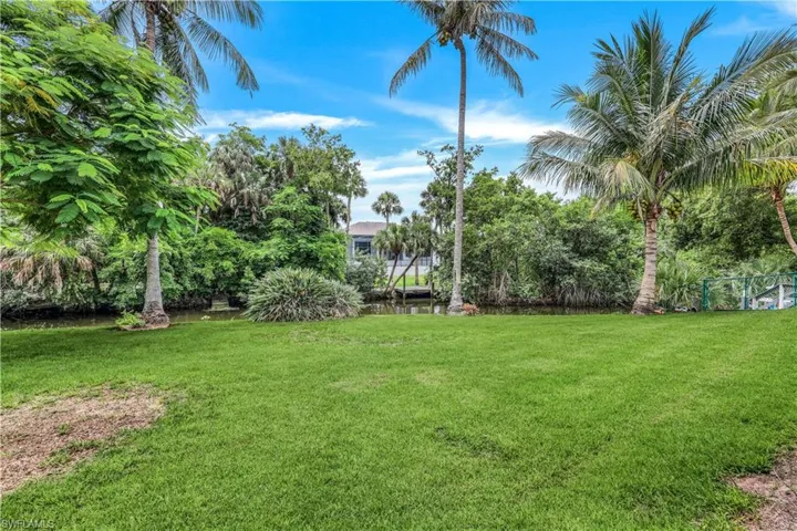 View of yard with a water view