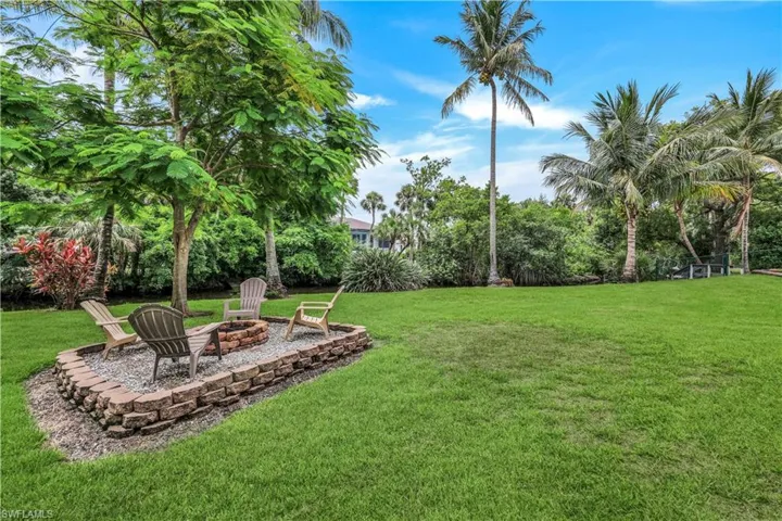 View of yard with a fire pit