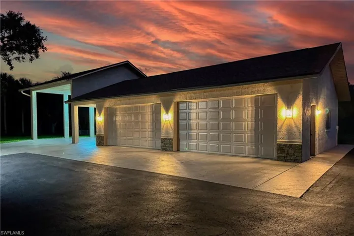 View of front of property featuring a garage