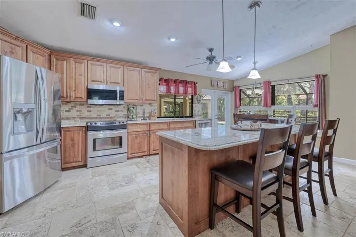 Solid Wood Cabinetry and Stainless Steel and Granite