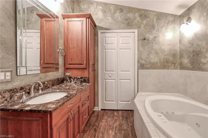 Bathroom featuring hardwood / wood-style floors and vanity