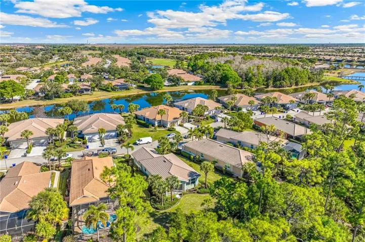 Aerial view of residential area featuring a large body of water