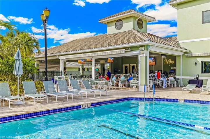 Community pool with a patio