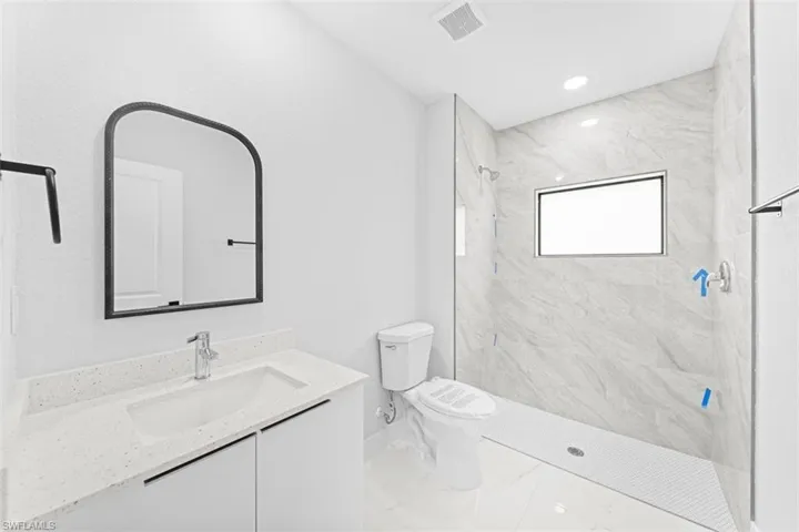 Vanity with integrated sink and chrome faucet