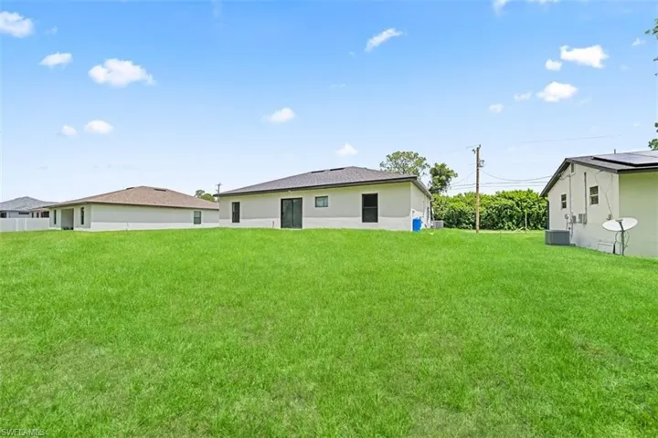 Expansive green space featuring a level grade and partial fencing
