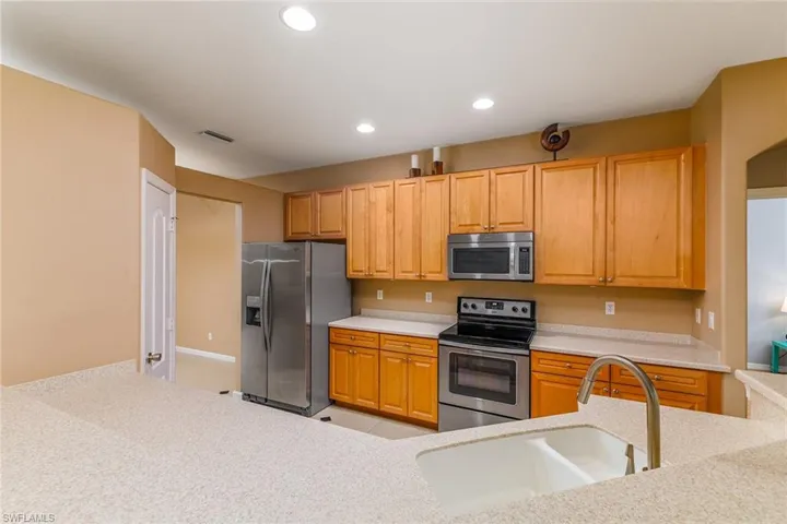 Kitchen featuring sink,  and appliances with stainless steel finishes