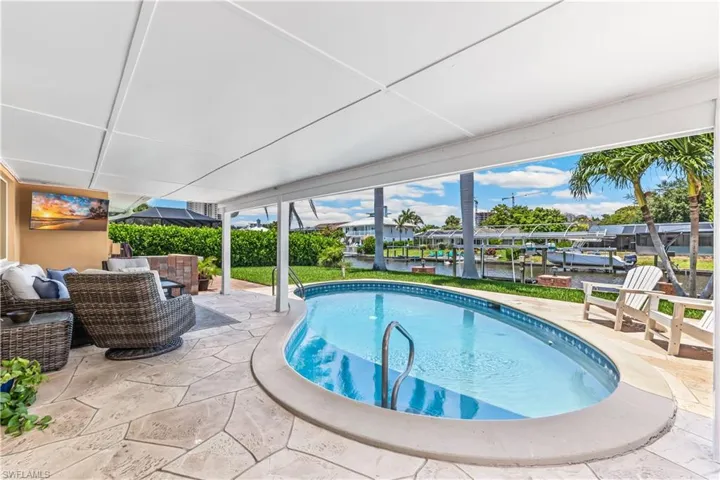 View of pool with an outdoor hangout area and a patio