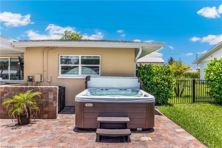 View of terrace with a hot tub