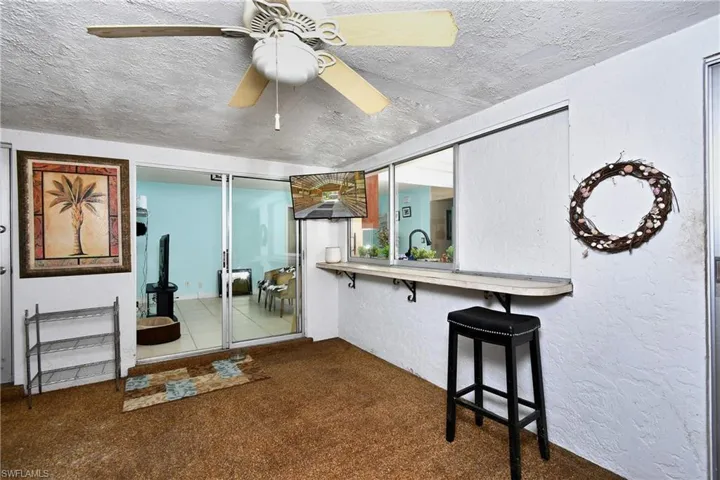 Sunroom bar and pass thru window from Kitchen