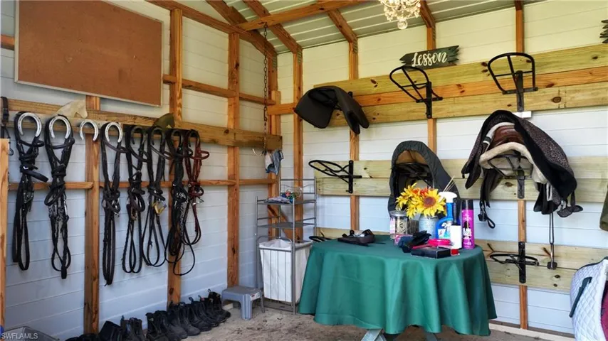 Tack room with A/C and a chandelier