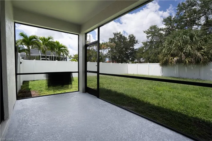 Screened lanai with a textured concrete floor