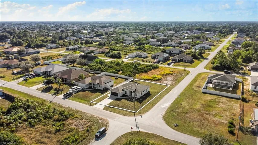 Aerial view of residential area with property boundaries highlighted