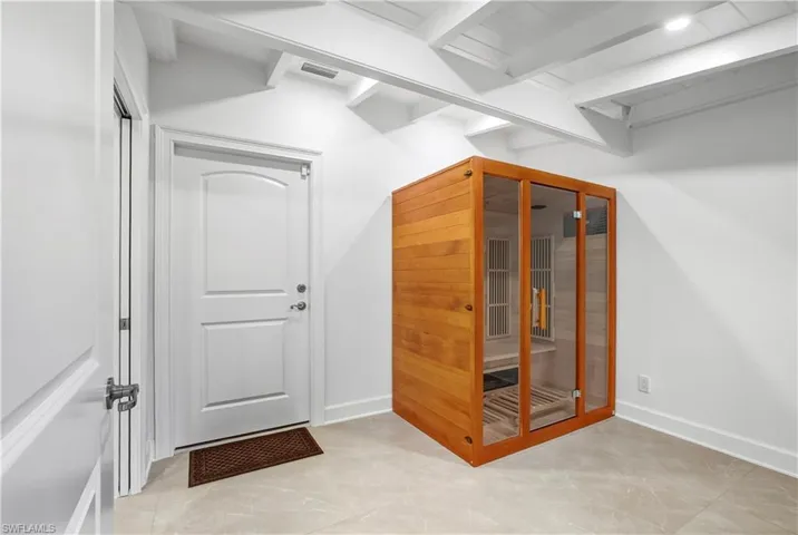 Additional living space with a relaxing sauna and beam ceiling