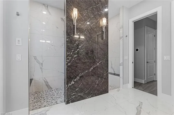 Bathroom featuring tiled shower
