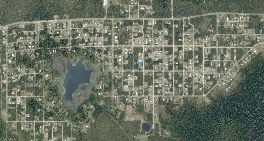 Aerial Map. Depicting the property location within a grid-patterned residential area with surrounding natural features