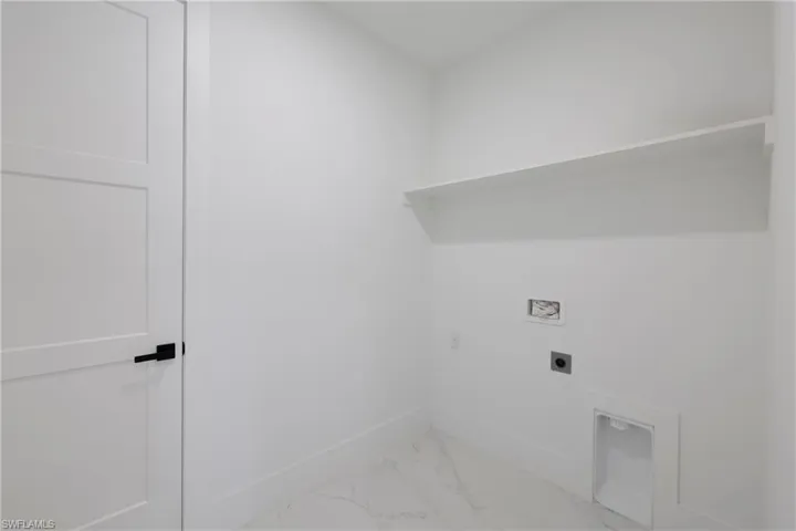 Clothes washing area with hookup for an electric dryer and washer hookup