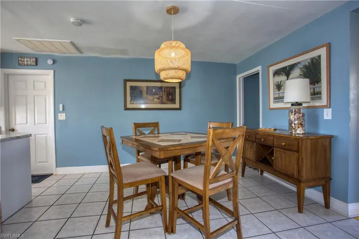 Dining area featuring light tile patterned floors