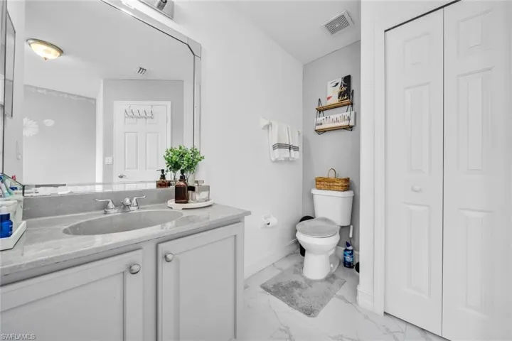 Guest bath vanity and linen closet