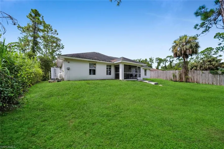 Rear exterior and open lawn