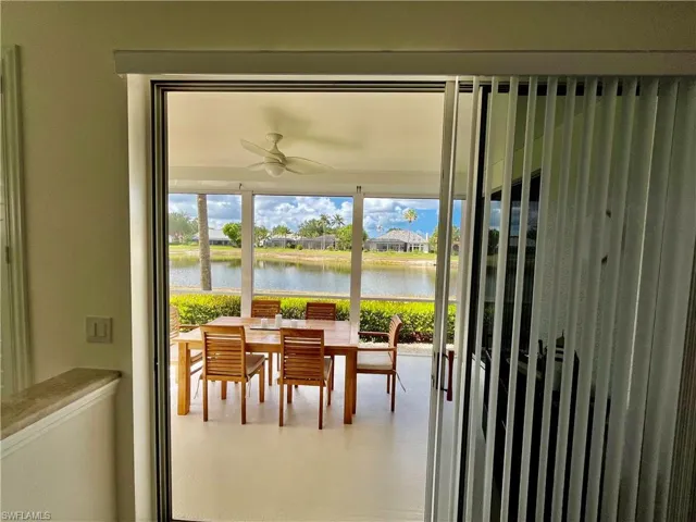 Sunroom with a water view
