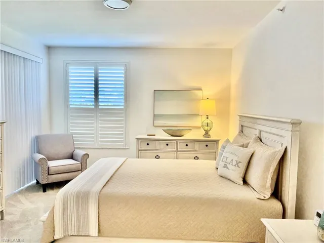 Bedroom with light colored carpet
