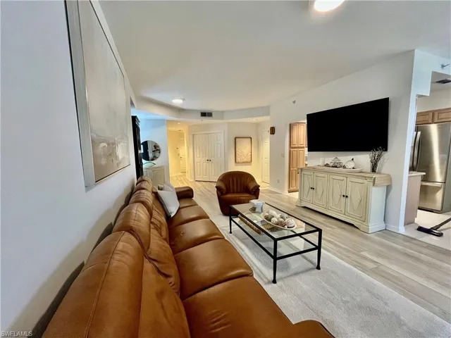 Living area with light wood finished floors
